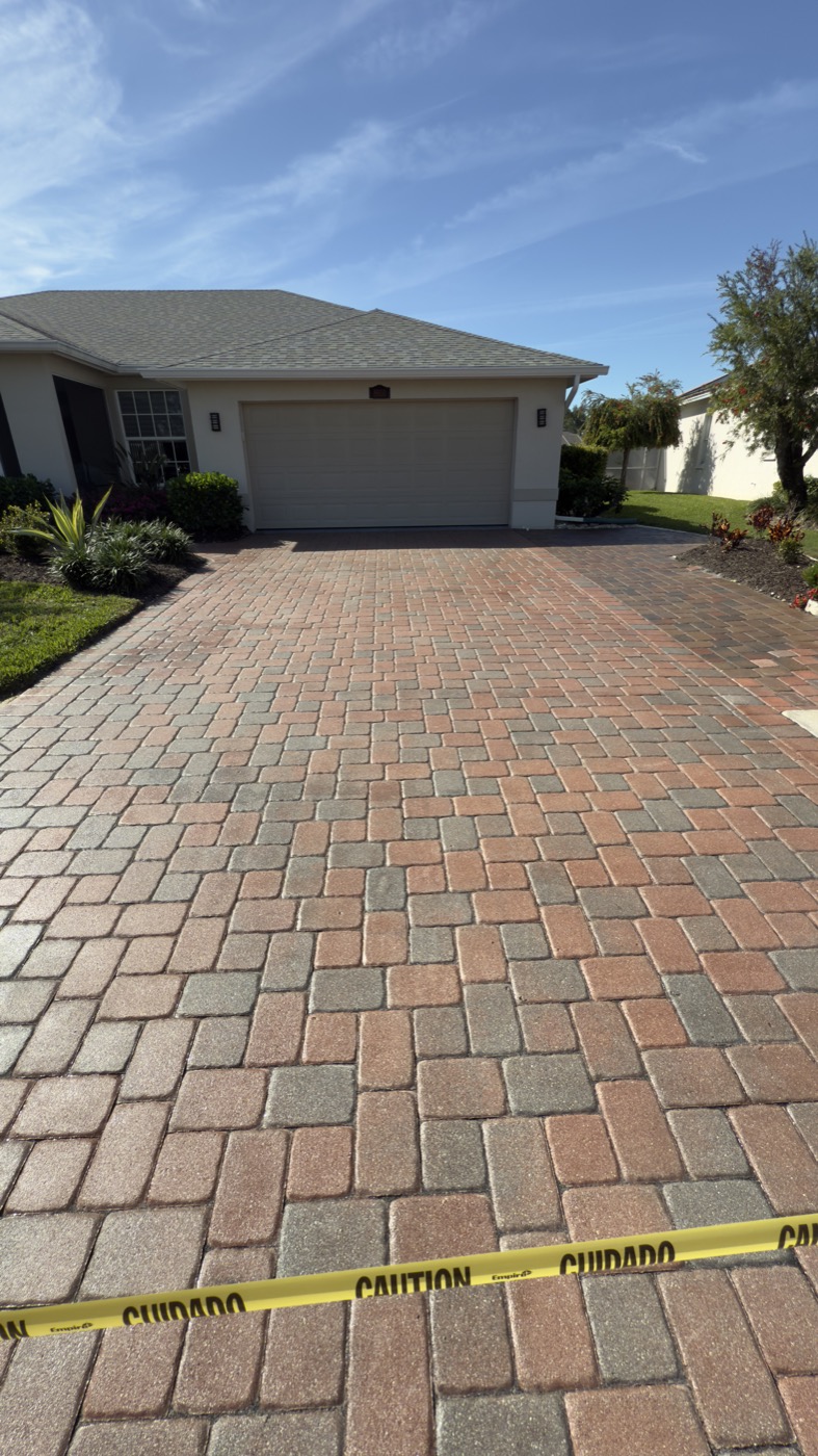 Same Stoneybrook driveway restored, with rich terracotta paver color after cleaning and sealing