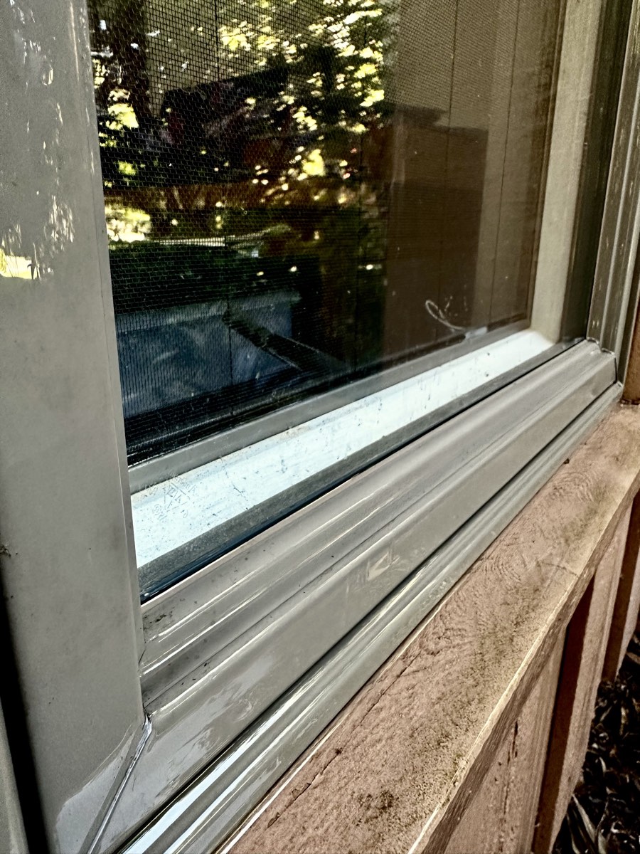 Same window screen and sill clean and clear after a wash