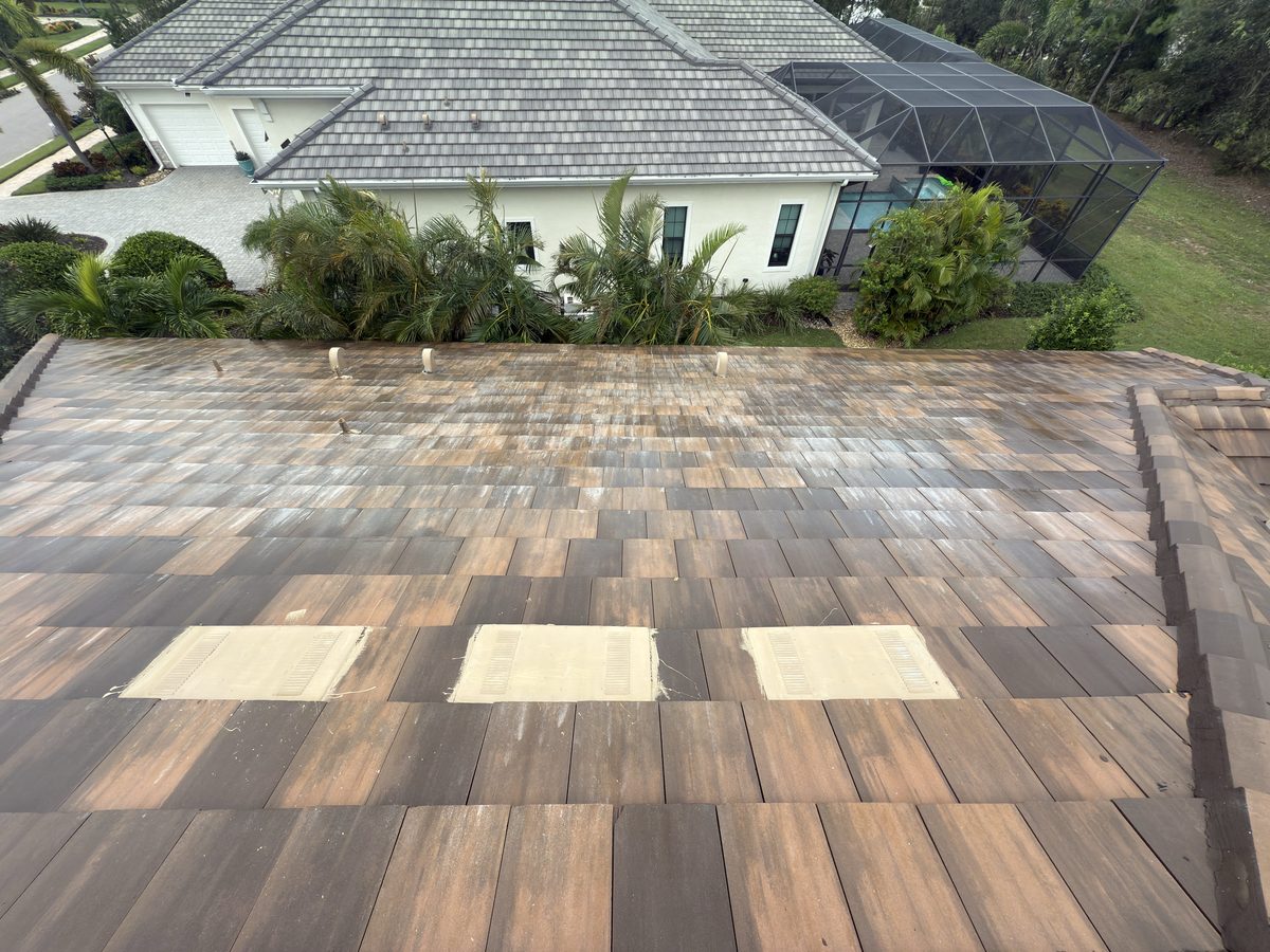 Same terracotta tile roof after soft washing, restored to its original color
