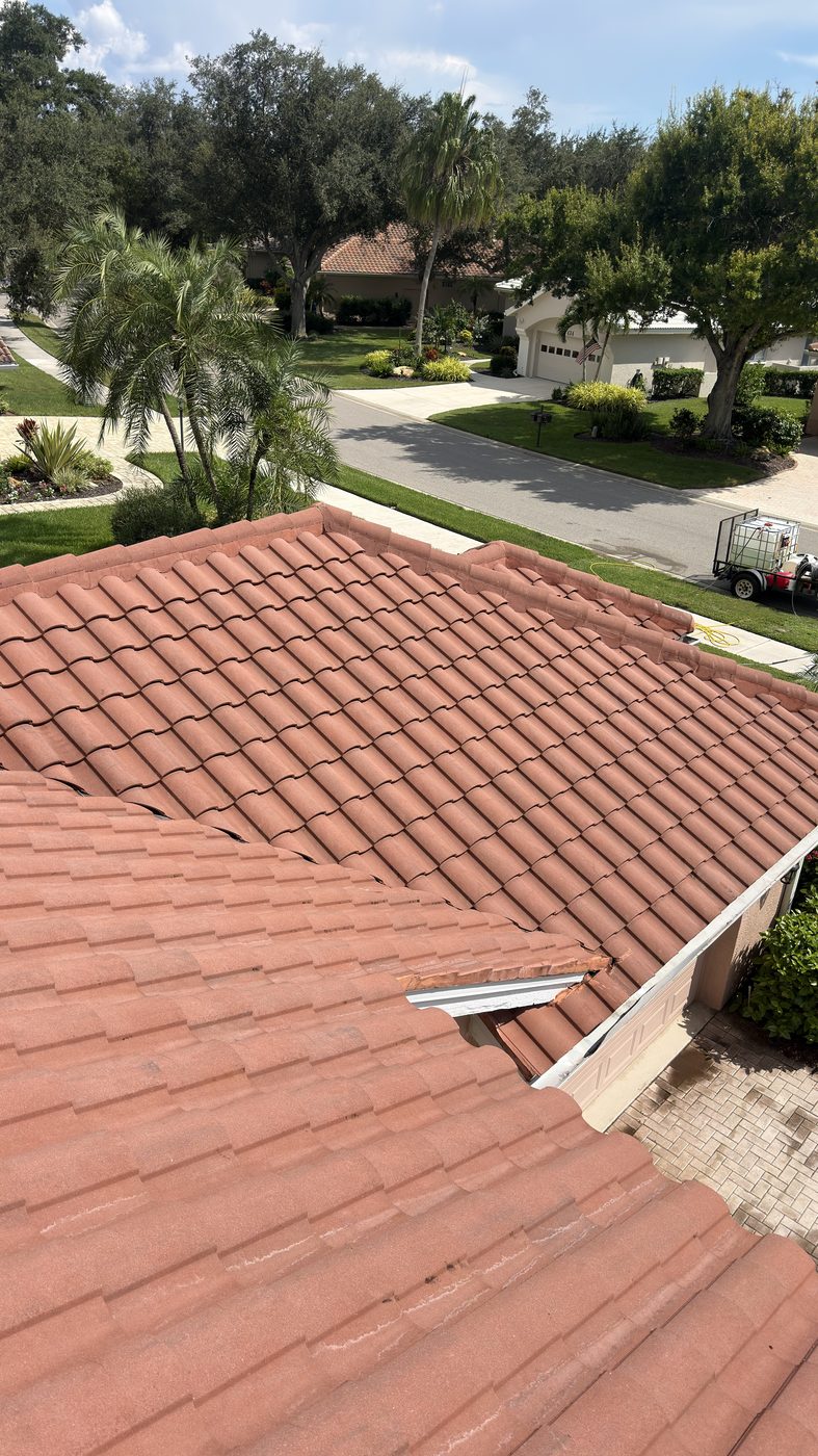 Same Venice Country Club tile roof after soft washing, algae staining removed